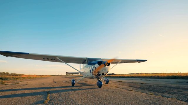 Airplane moving on a runway, close up.