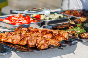 Shish kebab and other street food on a table