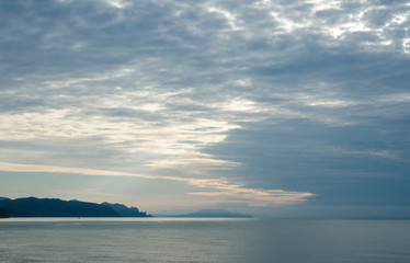 against the sky sea and mountain