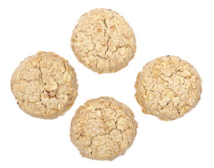 Integral round oatmeal cookies with raisins isolated on white background, top view