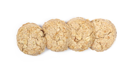 Integral round oatmeal cookies with raisins isolated on white background, top view