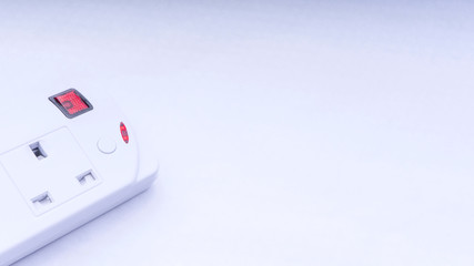 Extension cord and power plug on white background with selective focus and crop fragment