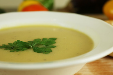 Cream soup with lentil with parsley and fresh bread