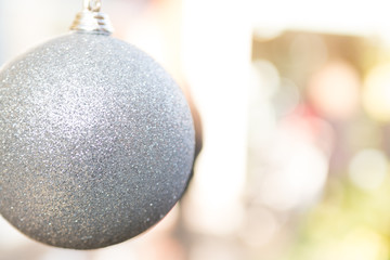 Christmas bauble decorations hanging on festive tree