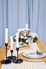 Table served for Christmas dinner in living room, close up view