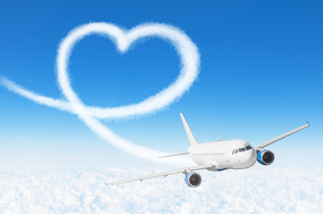 Love heart cloud drawing by airplane. Love concept for traveling the world.