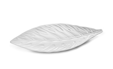 Decorative plate in shape of leaf on white background