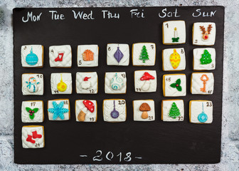 Homemade gingerbread christmas cookies advent calendar on black background