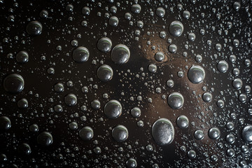 Water droplets on black background rain macro