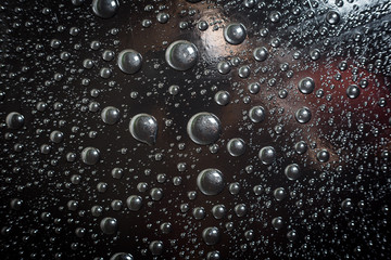 Water droplets on black background rain macro