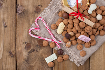 Dutch holiday Sinterklaas greeting card and traditional sweets kruidnoten, pepernoten for the. Festive concept with copy space.