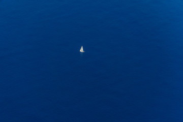 Sailing yacht. Lonely sailing yacht sailing on the sea