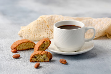 Good morning concept - breakfast frothy espresso coffee accompanied by delicious Italian almond...