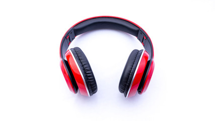 Wireless headphones closeup on white background with selective focus and crop fragme