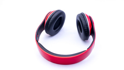 Naklejka premium Wireless headphones closeup on white background with selective focus and crop fragme