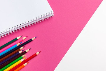 Pencil crayon on a bright pink background. Art concept