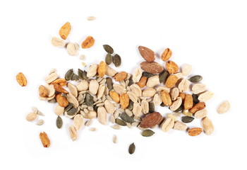 Healthy food mix of salted and spicy peanuts, sunflower and pumpkin seeds, almonds isolated on white background, top view