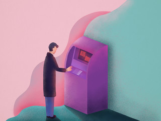 Man standing in front of a ATM withdrawing money