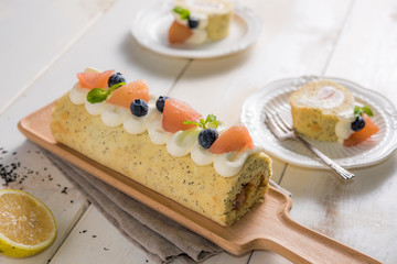 Cake roll with fresh fruits decorations