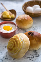 Traditional breads with ingredients on bright background