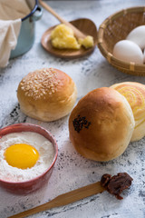 Traditional breads with ingredients on bright background