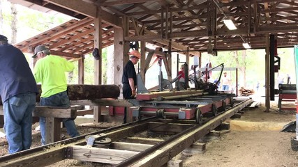 Old fashion working lumber mill demonstration