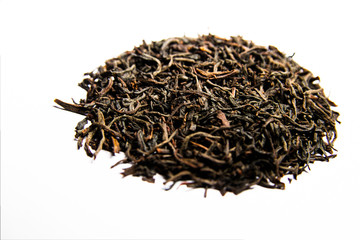 Black tea leaves on a white background