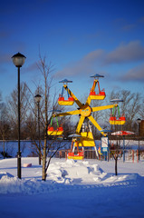 summer roundabout in winter furniture in the amusement park