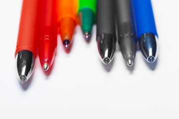 different colors pens isolated on the white background