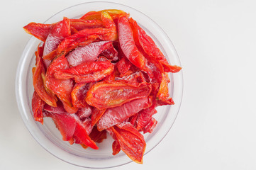 Frozen red bell pepper on white background