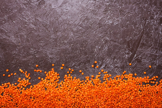 Lentils on the table. This legume contains a lot of vegetable protein. Top view