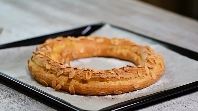 Freshly baked choux pastry cake. Making homemade choux pastry cake Paris Brest with raspberries.