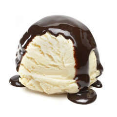 Vanilla ice cream scoop with chocolate sauce from side view isolated on white background.