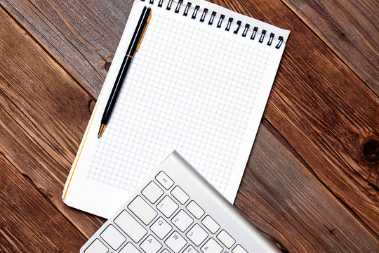 Computer keyboard, notebook and pen