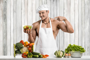 Man bodybuilder on kitchen