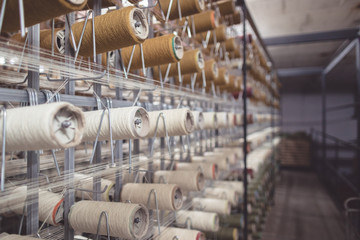 Clothing industry textile sewing thread wire fabric factory for textile material or clothing. cloth machine production thread. sewing production machinery garment