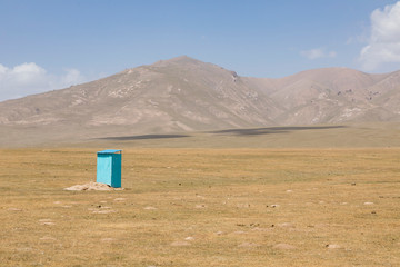 A lonely toilet at Song Kul lake in Kyrgyzstan