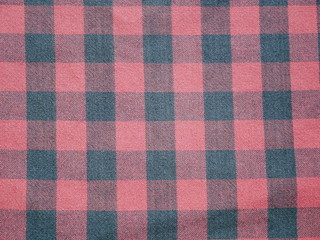 Red Square pattern fabric background. Scott chintz fabric for design.Plaid cotton texture.