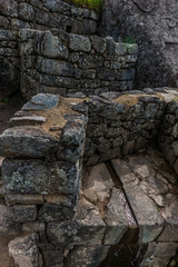 Building at the abandoned citadel of Machu Picchu on top of a Mountain Ridge above the Sacred Valley.