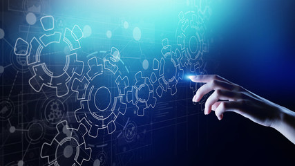 Gears mechanism on virtual screen. Automation and business process flow. Business and technology...