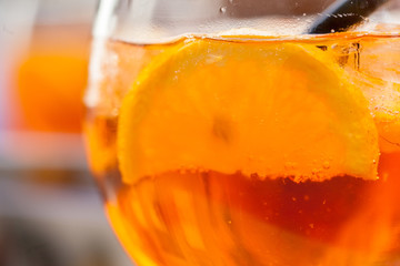Glass of aperol spritz cocktail. Close up, macro view