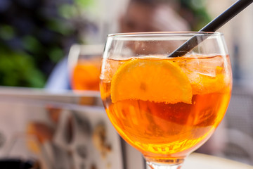 Glass of aperol spritz cocktail. Close up, macro view