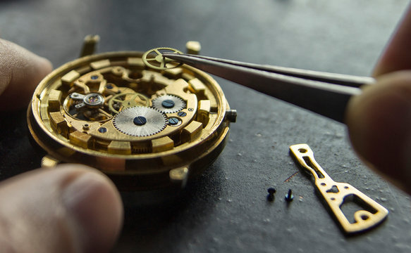 Watchmaker is repairing the mechanical watches in his workshop