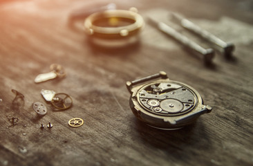 Watchmaker is repairing the mechanical watches in his workshop