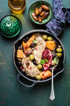 Chicken and pumpkin tagine with olives and pomegranade