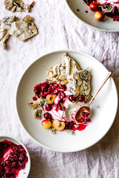 Cherry eton mess with poppyseed almond meringues