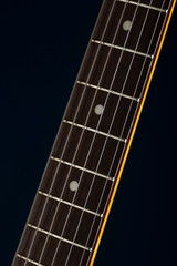 close up of an electric guitar strings