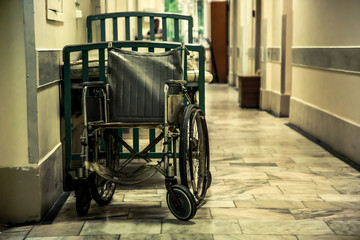 Fototapeta na wymiar Photo of an empty wheelchair in the hospital room