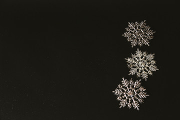 Happy New Year 2019. Christmas background. Winter holidays concept.  Snowflakes, New Year's decoration on a dark board.