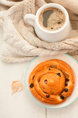 First snow. Cozy breakfast on the veranda: coffee and cinnamon and raisin bun.